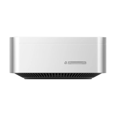A silver vzmore ax7 mini pc with a black vented base and a small front-mounted display.